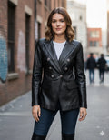 Women's black double-breasted leather blazer with silver button hardware and notch lapel