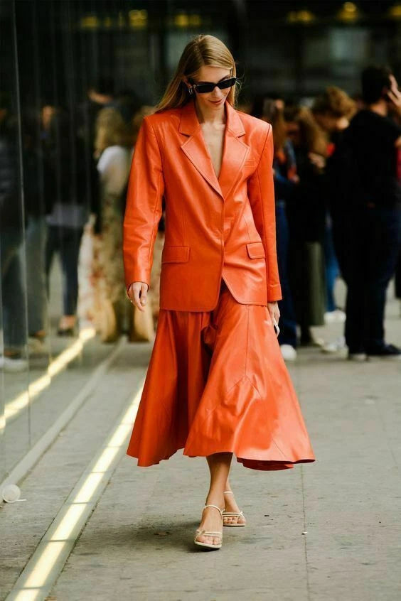Orange leather co-ord set — blazer and midi flare skirt