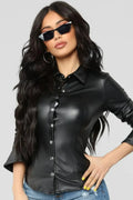Women's black leather fitted shirt with silver snap buttons and sharp point collar