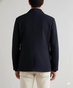 Front view of a navy blue casual tailored blazer with notched lapel and two-button closure