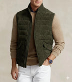 Front view of olive green quilted zip vest on model
