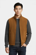 Front view of tan stand-collar zip vest on model