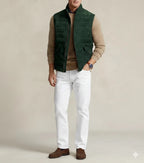 Front view of men's dark green quilted zip-up vest