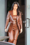 Cognac leather single-button blazer with peak lapel worn as monochrome celebrity street style