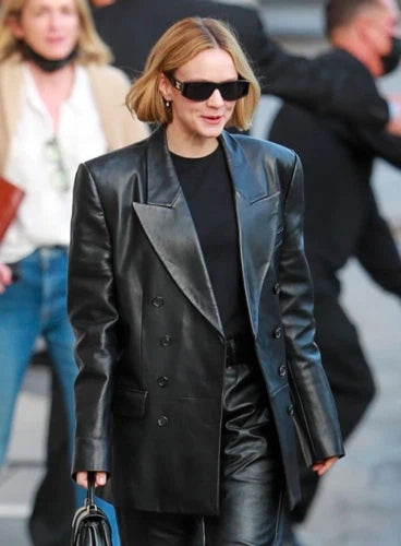 Black leather oversized double-breasted blazer with peak lapel worn as celebrity street style
